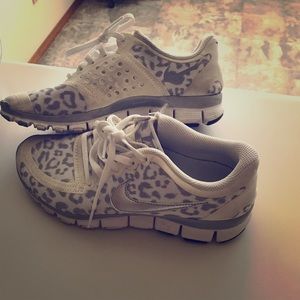 Nike White and Silver Cheetah print shoes.